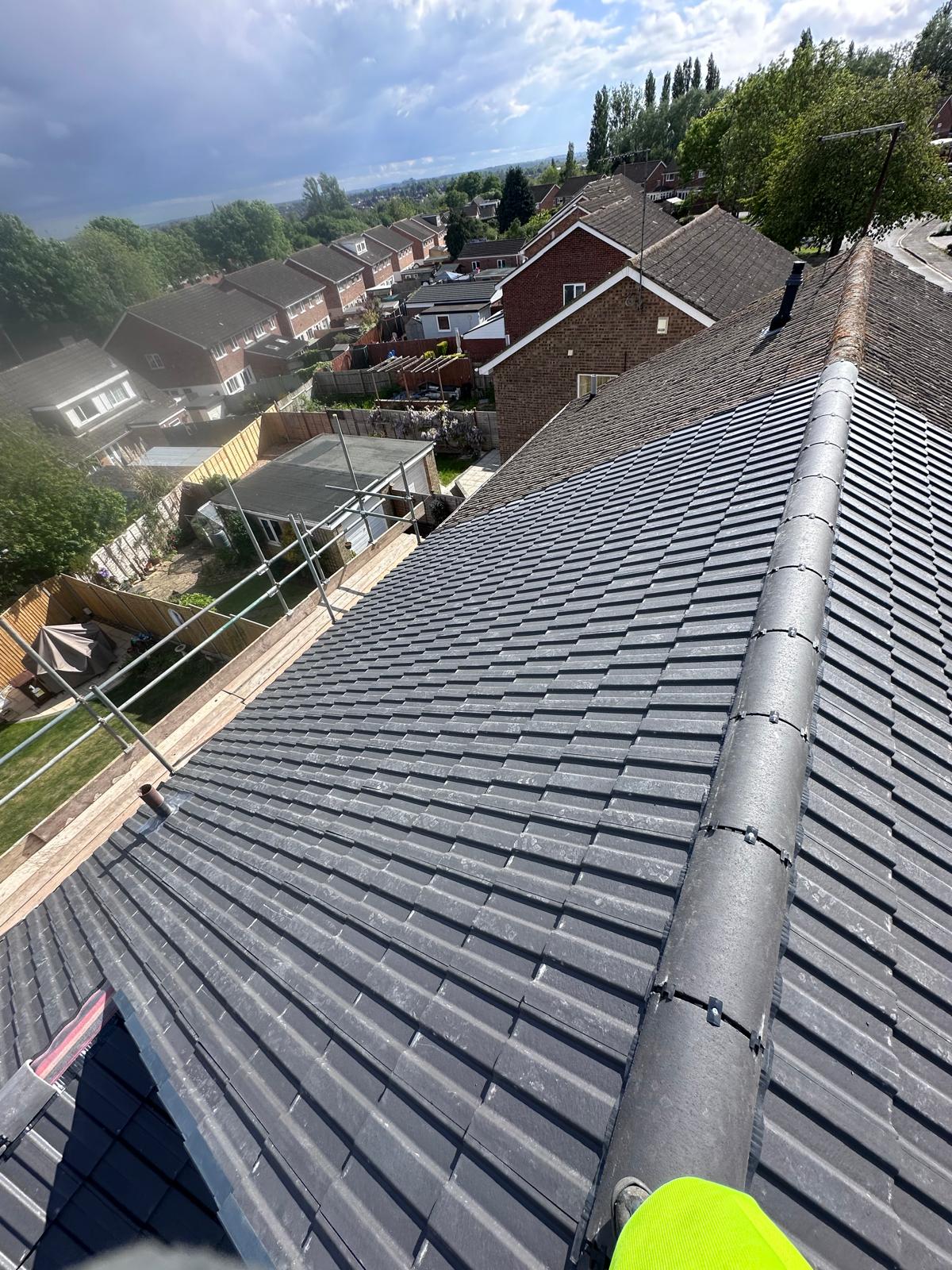 New grey tile roof after installation